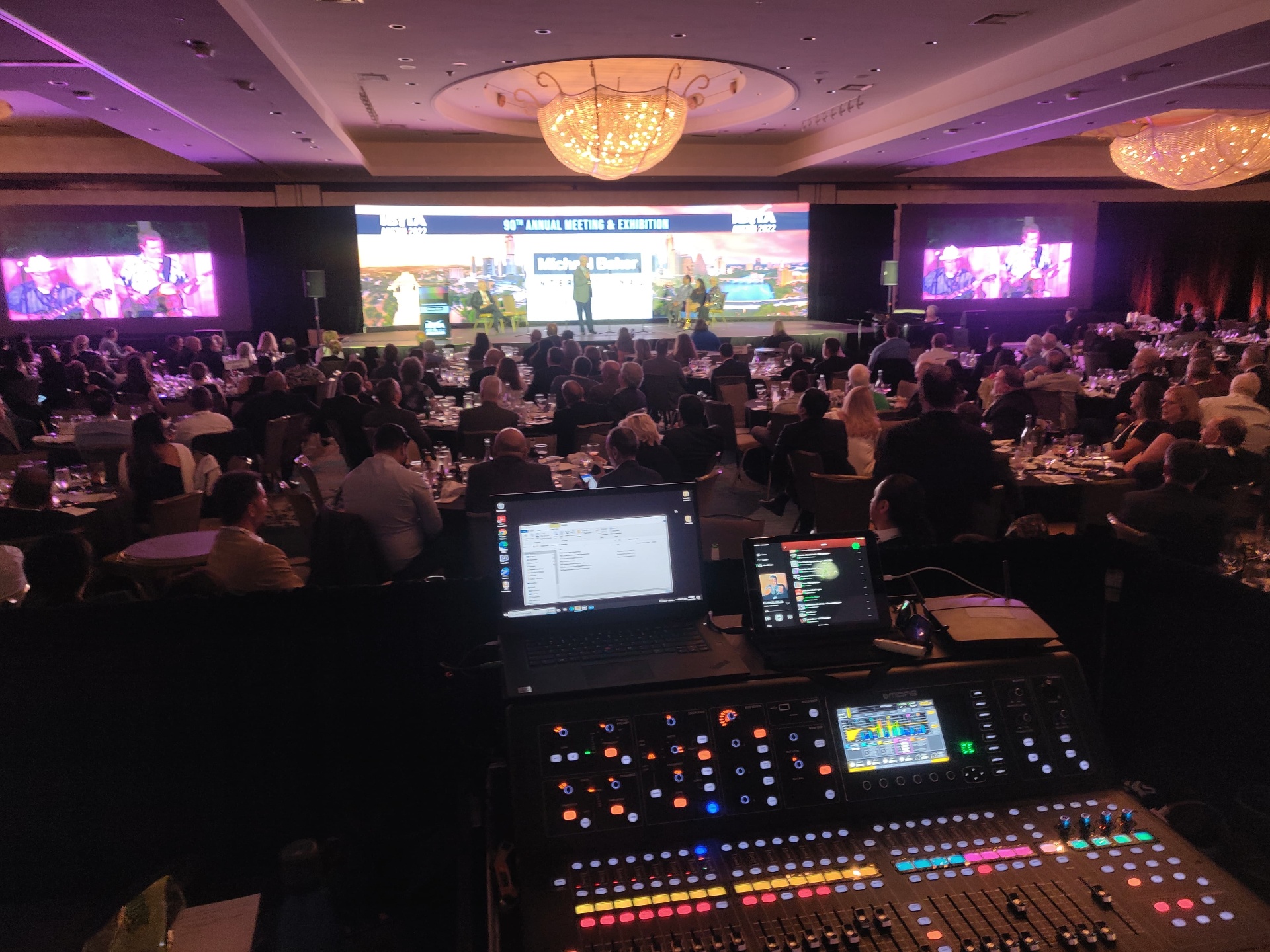 Gala dinner with packed ballroom, LED screens and stage