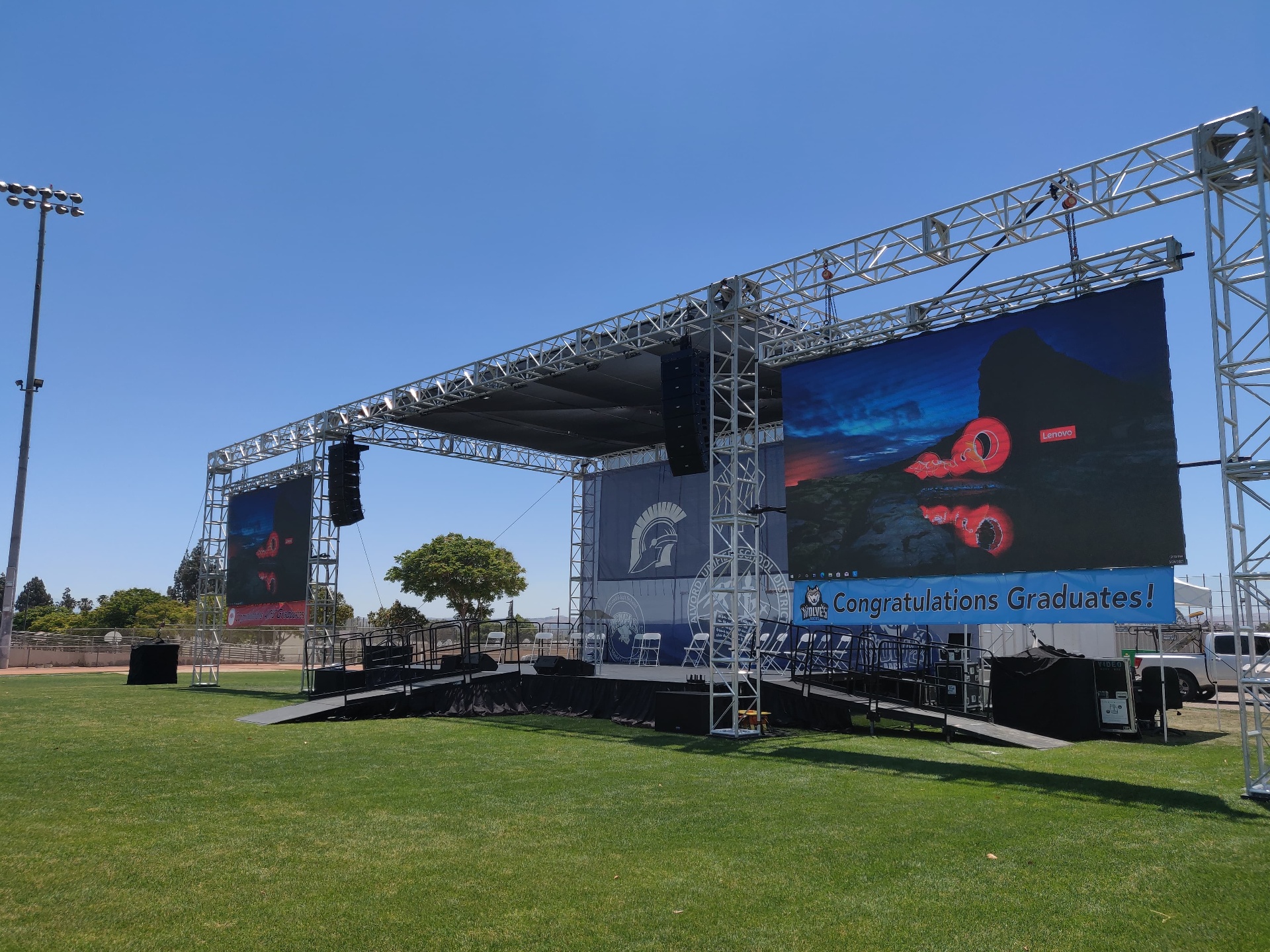 Outdoor concert stage with LED video walls and full lighting rig